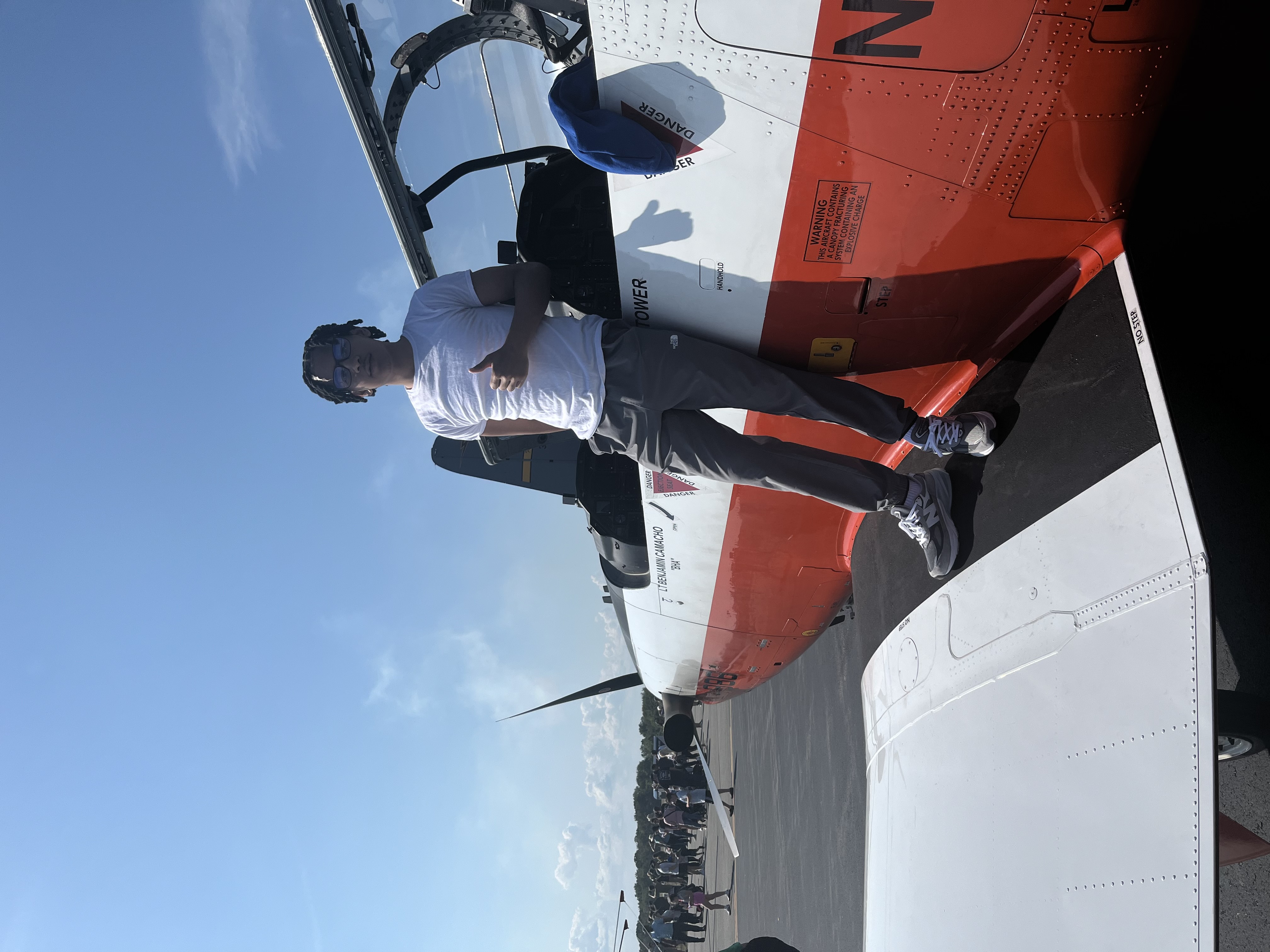 Tiago Antunes photographed while standing on the wing of an airplane